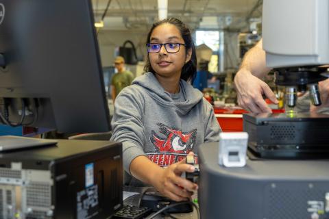 A SPDI student working in the lab